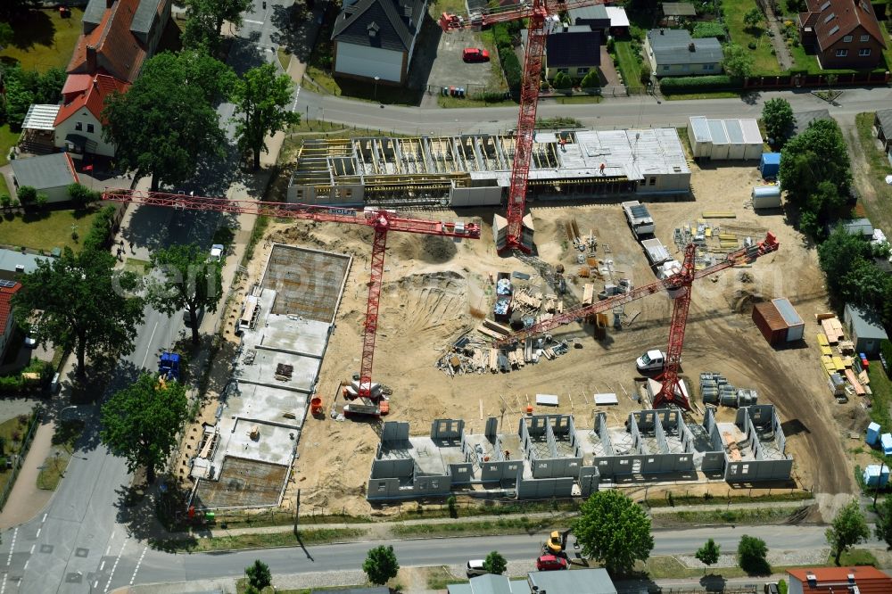 Oranienburg from the bird's eye view: Construction site to build a new multi-family residential complex Strasse of Einheit corner Waldstrasse in Oranienburg in the state Brandenburg, Germany