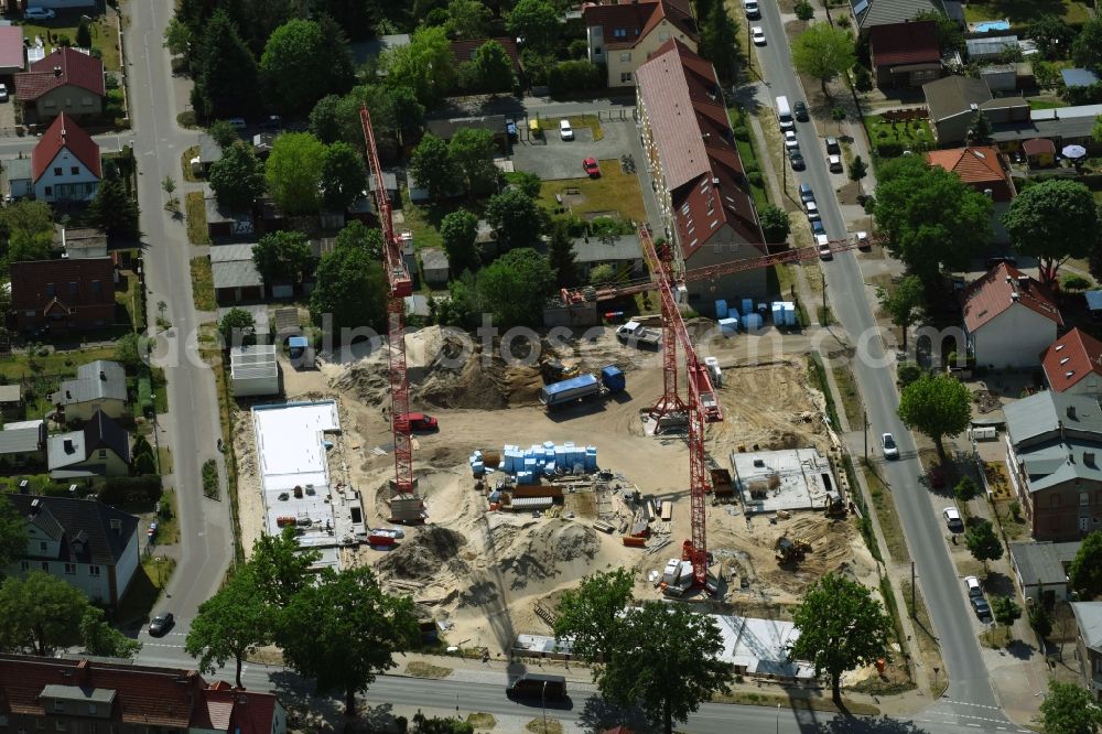 Aerial photograph Oranienburg - Construction site to build a new multi-family residential complex Strasse of Einheit corner Waldstrasse in Oranienburg in the state Brandenburg, Germany