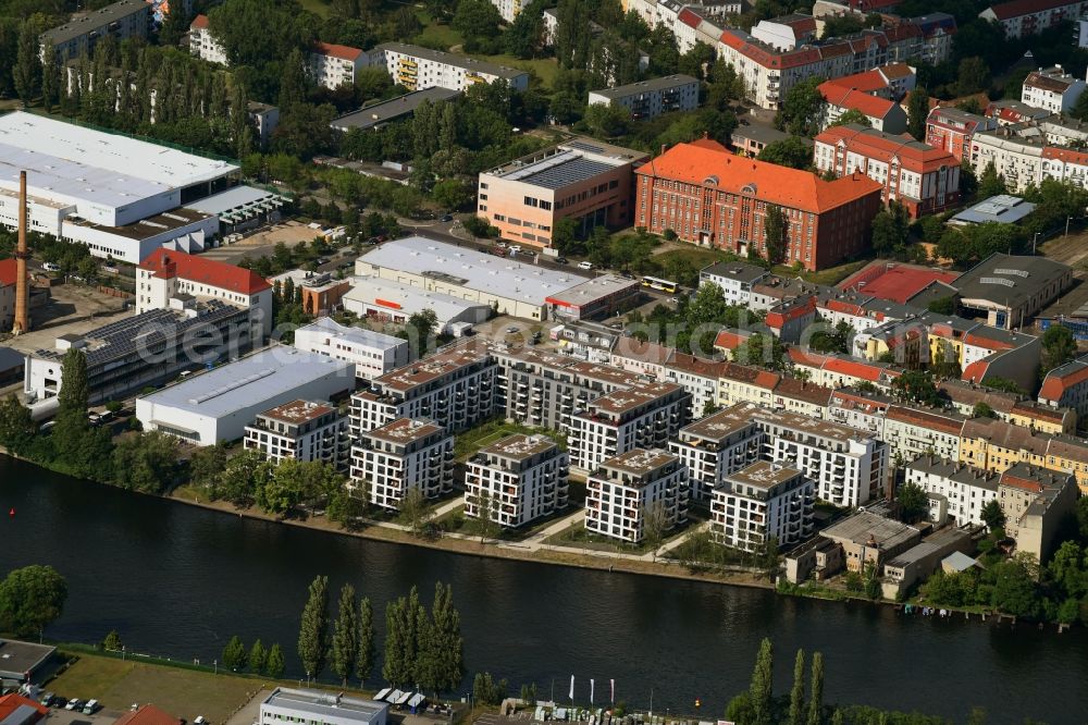 Berlin from above - Construction site to build a new multi-family residential complex in the Tabbertstrasse in Schoeneweide on the river banks of the Spree in Berlin