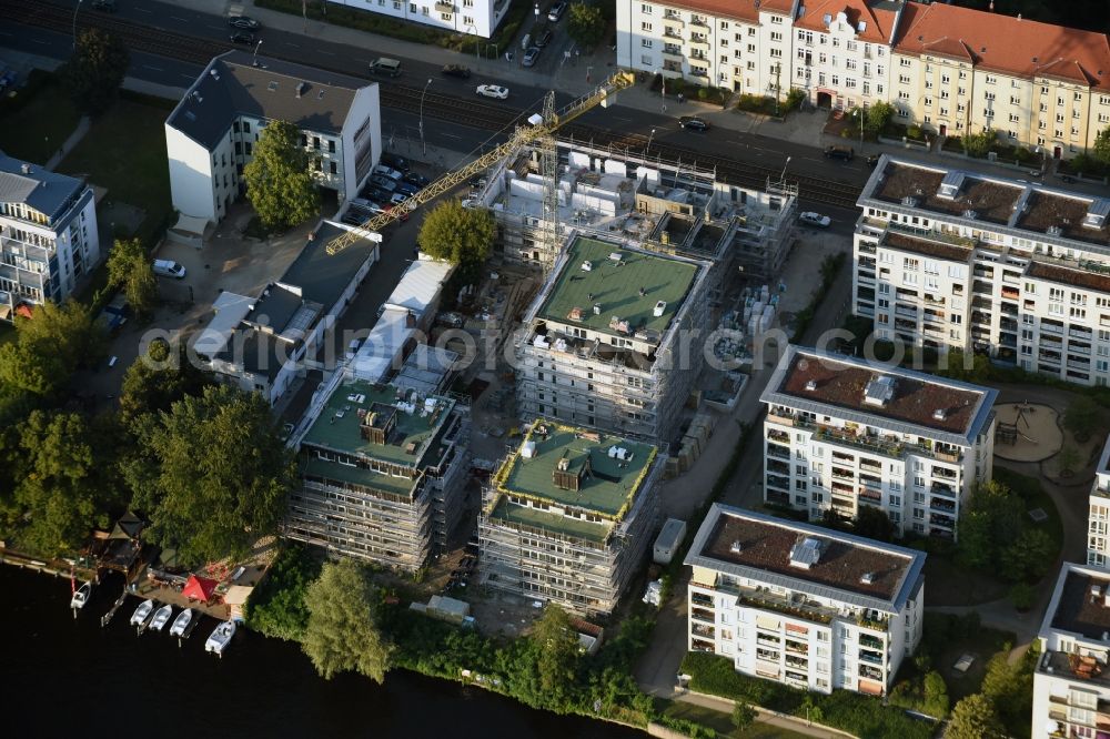 Berlin from the bird's eye view: Construction site to build a new multi-family residential complex at Koepenick Lindenstrasse in Berlin in Germany