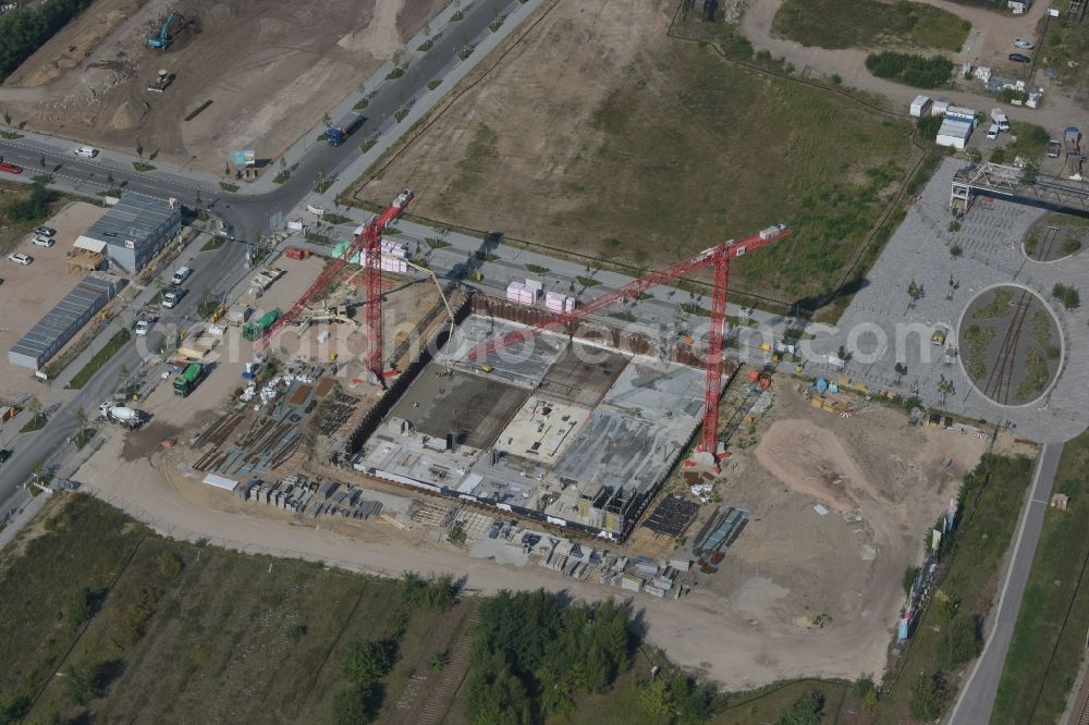 Berlin from the bird's eye view: Construction site to build a new multi-family residential complex of the project Square 1 on Wagner-Regeny-Allee in the district Niederschoeneweide in Berlin, Germany