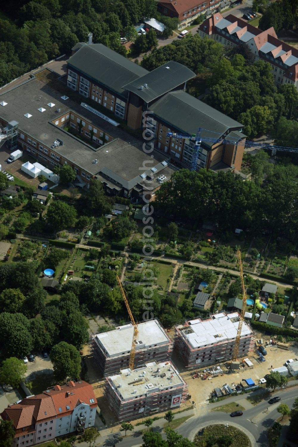 Aerial photograph Bernau - Construction site to build a new multi-family residential complex at the road Oranienburger Strasse in Bernau in the state Brandenburg. A project of the Wohnungsbaugesellschaft Wobau Bernau