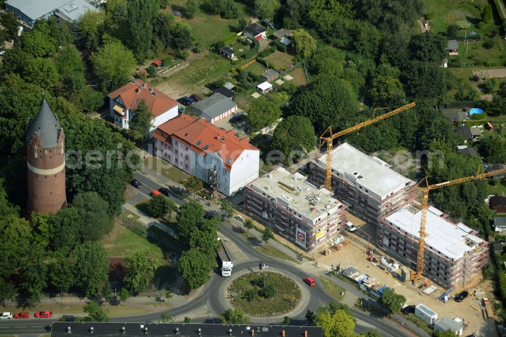 Bernau from above - Construction site to build a new multi-family residential complex at the road Oranienburger Strasse in Bernau in the state Brandenburg. A project of the Wohnungsbaugesellschaft Wobau Bernau