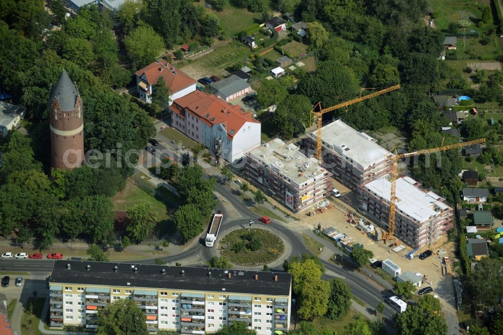 Bernau from the bird's eye view: Construction site to build a new multi-family residential complex at the road Oranienburger Strasse in Bernau in the state Brandenburg. A project of the Wohnungsbaugesellschaft Wobau Bernau