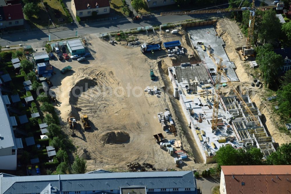 Teltow from the bird's eye view: Construction site to build a new multi-family residential complex Wohnen on Striewitzweg of Bonava Deutschland GmbH in Teltow in the state Brandenburg, Germany