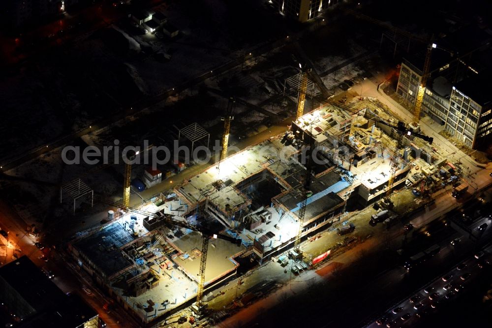 München from above - Night view of construction site to build a new multi-family residential complex on Schwabinger Tor along Leopoldstrasse in Munich in the state Bavaria