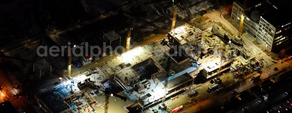 München from the bird's eye view: Night view of construction site to build a new multi-family residential complex on Schwabinger Tor along Leopoldstrasse in Munich in the state Bavaria