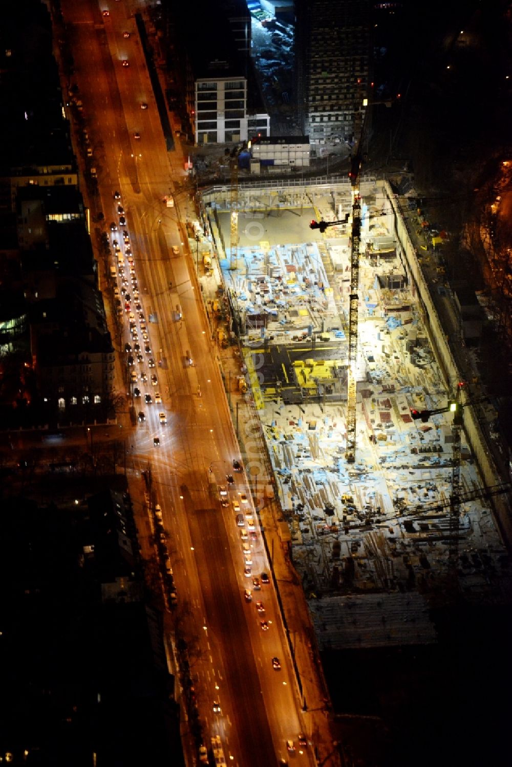 München from above - Night view of construction site to build a new multi-family residential complex on Schwabinger Tor along Leopoldstrasse in Munich in the state Bavaria