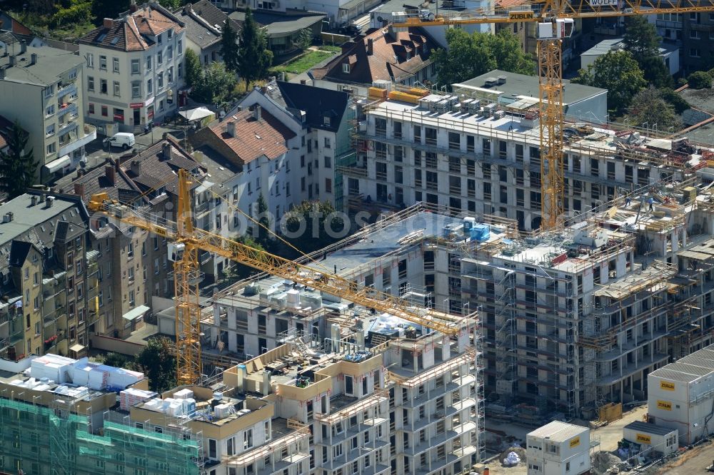 Offenbach am Main from the bird's eye view: Construction site to build a new multi-family residential complex of Ed. Zueblin AG in Offenbach am Main in the state Hesse