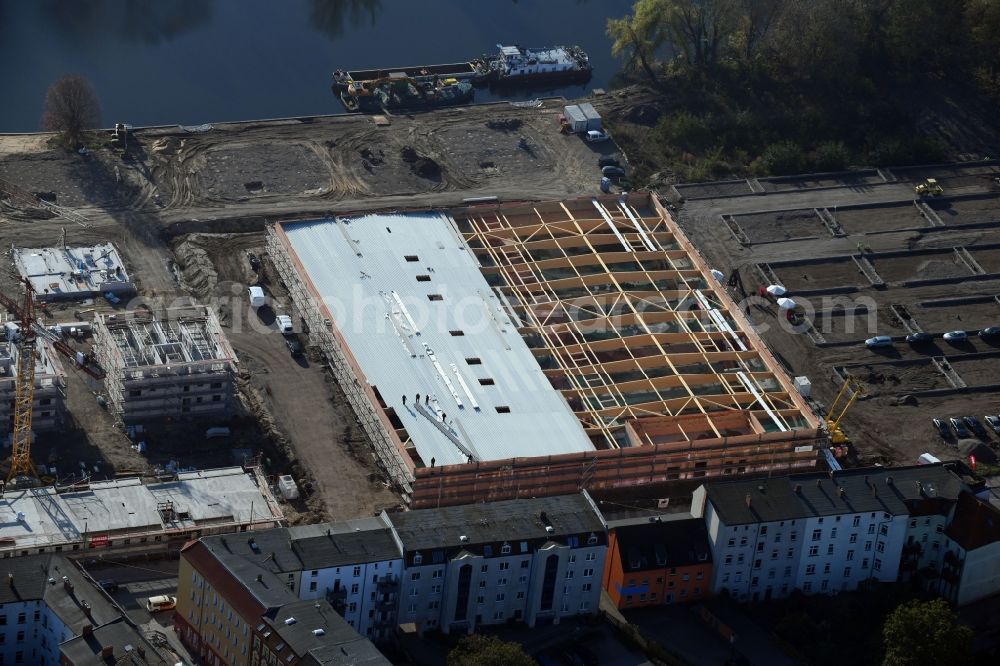 Brandenburg an der Havel from above - Construction site for the new building of apartment houses and a REWE-Center supermarket on Neuendorfer Strasse in Brandenburg an der Havel in the state Brandenburg, Germany