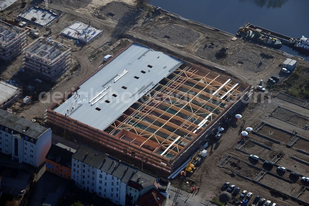 Brandenburg an der Havel from above - Construction site for the new building of apartment houses and a REWE-Center supermarket on Neuendorfer Strasse in Brandenburg an der Havel in the state Brandenburg, Germany