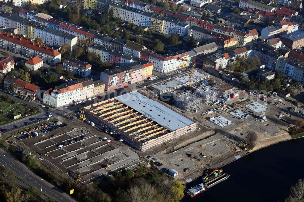 Aerial photograph Brandenburg an der Havel - Construction site for the new building of apartment houses and a REWE-Center supermarket on Neuendorfer Strasse in Brandenburg an der Havel in the state Brandenburg, Germany