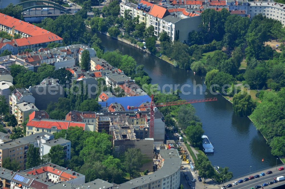 Berlin from above - Construction site for renovation and construction of a multi-family dwelling by the construction company WOLFF at the Charlottenburg shore on the Caprivibrücke the Spree course in Berlin Charlottenburg