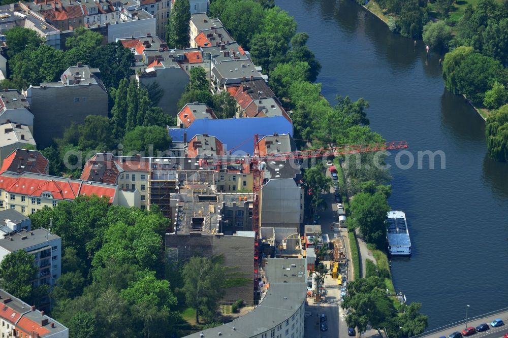 Berlin from above - Construction site for renovation and construction of a multi-family dwelling by the construction company WOLFF at the Charlottenburg shore on the Caprivibrücke the Spree course in Berlin Charlottenburg