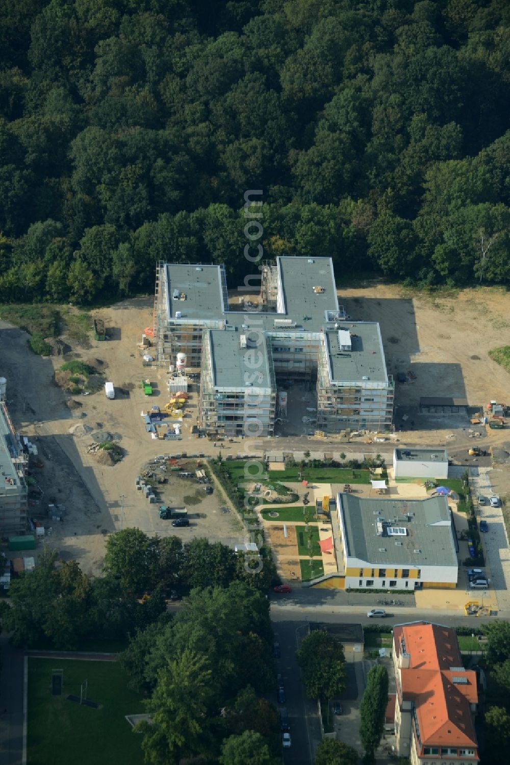 Aerial image Leipzig - Construction site for the new building of a multi-generational project in Leipzig in the state of Saxony. The compound includes the finished child day care facility, a sports school, an elderly care home. It is located on Goyastrasse