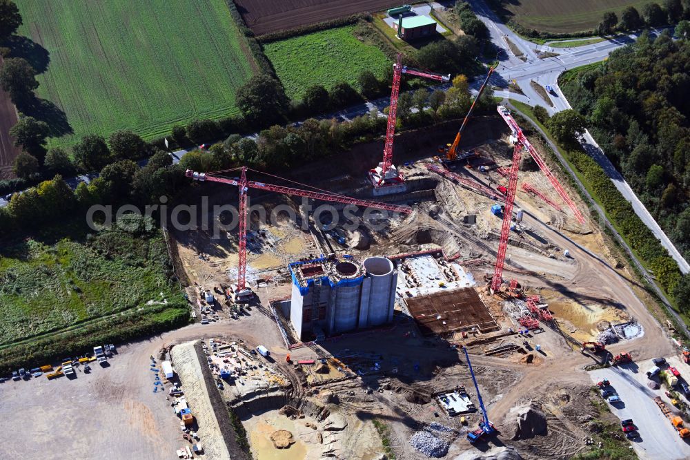 Stapelfeld from the bird's eye view: Construction site for the new construction of the waste incineration plant for waste treatment MVA residual waste combined heat and power plant and a mono sewage sludge incineration on the street Ahrensburger Weg in Stapelfeld in the state Schleswig-Holstein, Germany