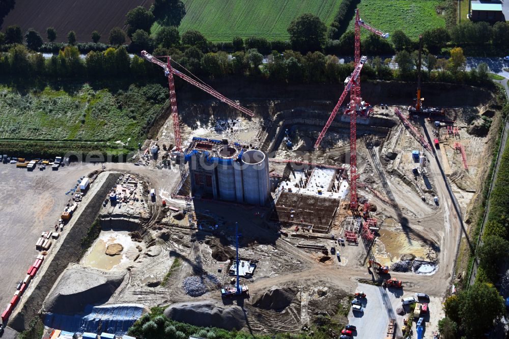 Stapelfeld from above - Construction site for the new construction of the waste incineration plant for waste treatment MVA residual waste combined heat and power plant and a mono sewage sludge incineration on the street Ahrensburger Weg in Stapelfeld in the state Schleswig-Holstein, Germany