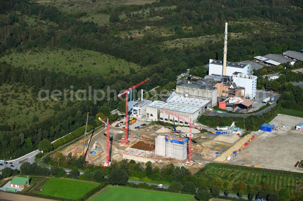 Stapelfeld from the bird's eye view: Construction site for the new construction of the waste incineration plant for waste treatment MVA residual waste combined heat and power plant and a mono sewage sludge incineration on the street Ahrensburger Weg in Stapelfeld in the state Schleswig-Holstein, Germany