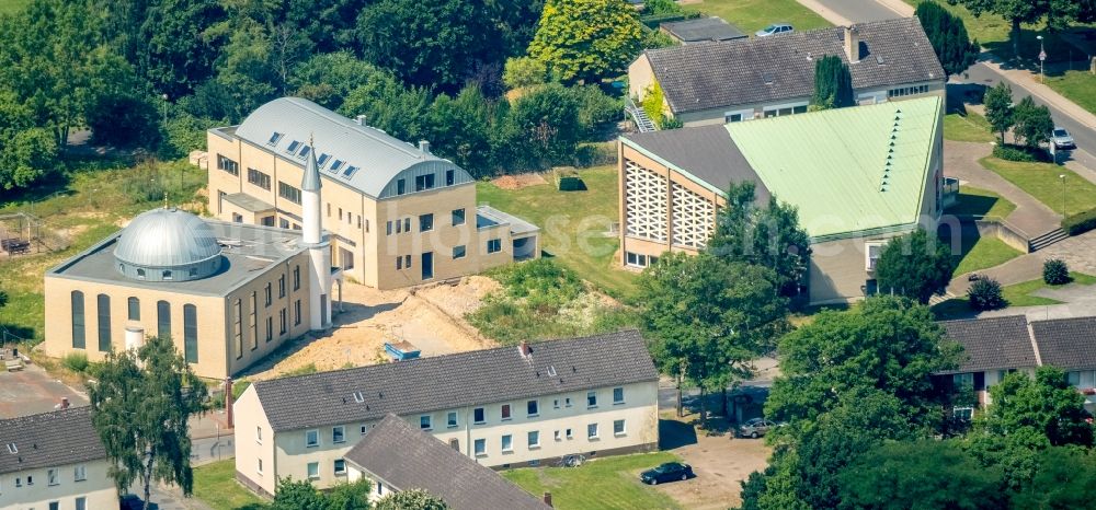 Möllen from the bird's eye view: Mosque construction site of Moschee Yeni YeA?il Camii in Schlesierstrasse gegenueber of Evangelischen Kirche Moellen in Moellen in the state North Rhine-Westphalia, Germany