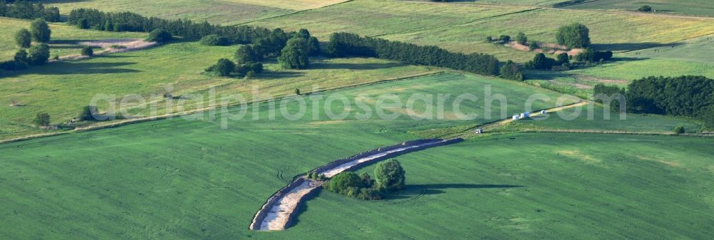 Werneuchen from above - Construction site for the new building a bypass road through a field in Weesower Luch in Werneuchen in the state Brandenburg