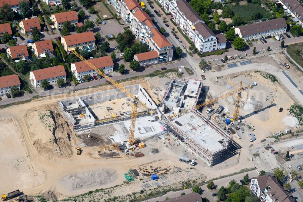 Hönow from the bird's eye view: Construction site for the new building city destrict center between of Schulstrasse and of Marderstrasse in Hoenow in the state Brandenburg, Germany