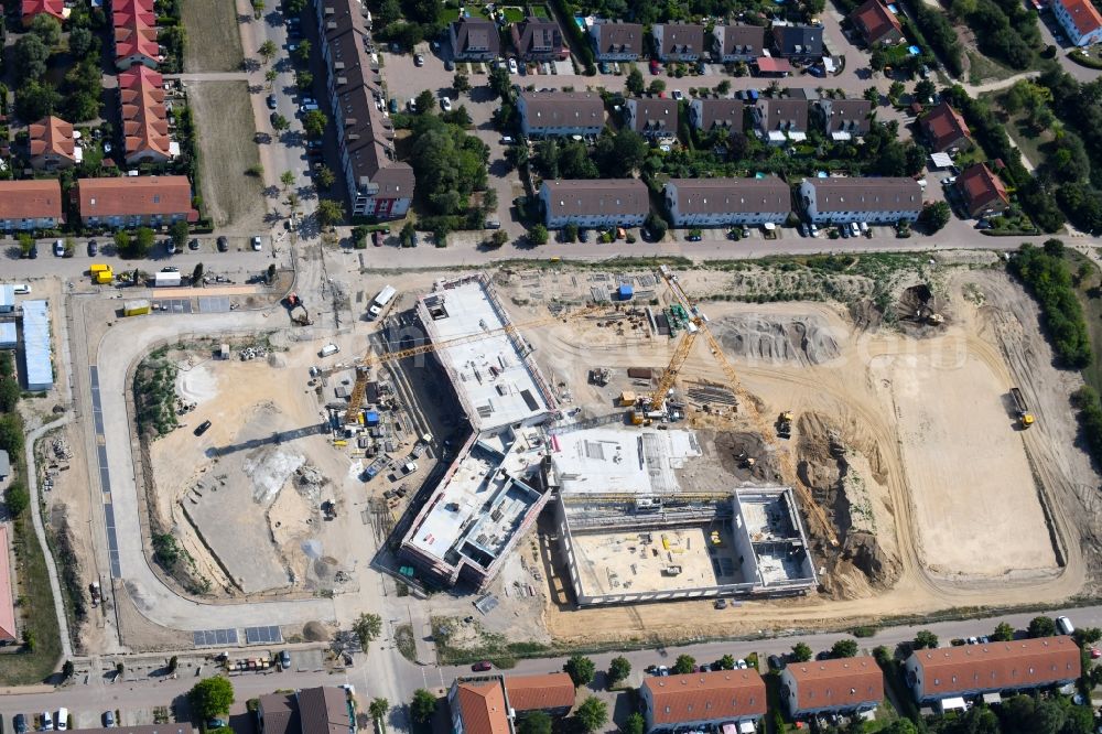 Hönow from the bird's eye view: Construction site for the new building city destrict center between of Schulstrasse and of Marderstrasse in Hoenow in the state Brandenburg, Germany