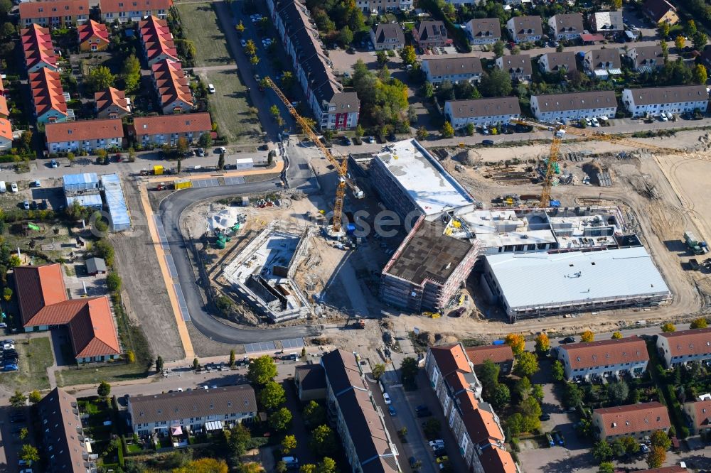 Hönow from the bird's eye view: Construction site for the new building city destrict center between of Schulstrasse and of Marderstrasse in Hoenow in the state Brandenburg, Germany