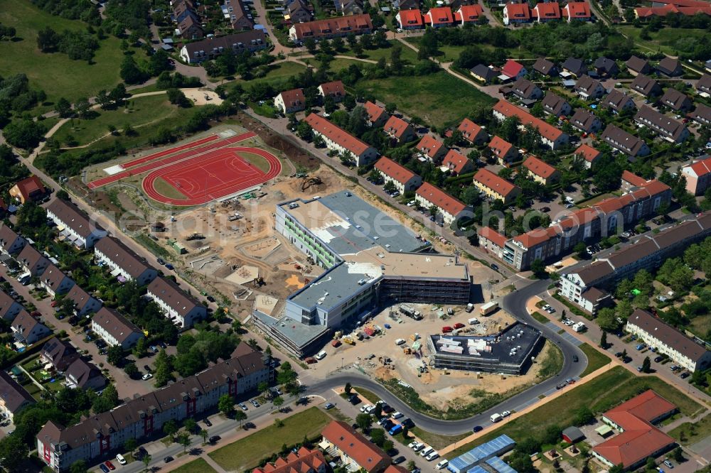 Hönow from the bird's eye view: Construction site for the new building city destrict center between of Schulstrasse and of Marderstrasse in Hoenow in the state Brandenburg, Germany