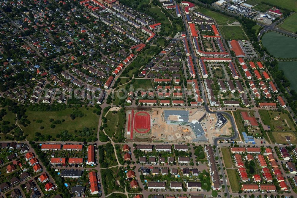 Hönow from the bird's eye view: Construction site for the new building city destrict center between of Schulstrasse and of Marderstrasse in Hoenow in the state Brandenburg, Germany