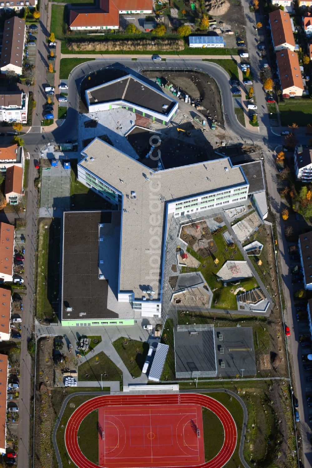 Hönow from the bird's eye view: Construction site for the new building city destrict center between of Schulstrasse and of Marderstrasse in Hoenow in the state Brandenburg, Germany