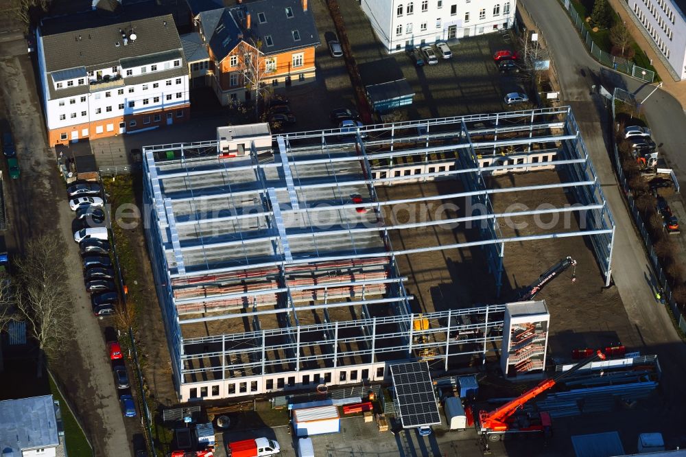 Bernau from the bird's eye view: Construction site for the new parking garage on Breitscheidstrasse in Bernau in the state Brandenburg, Germany