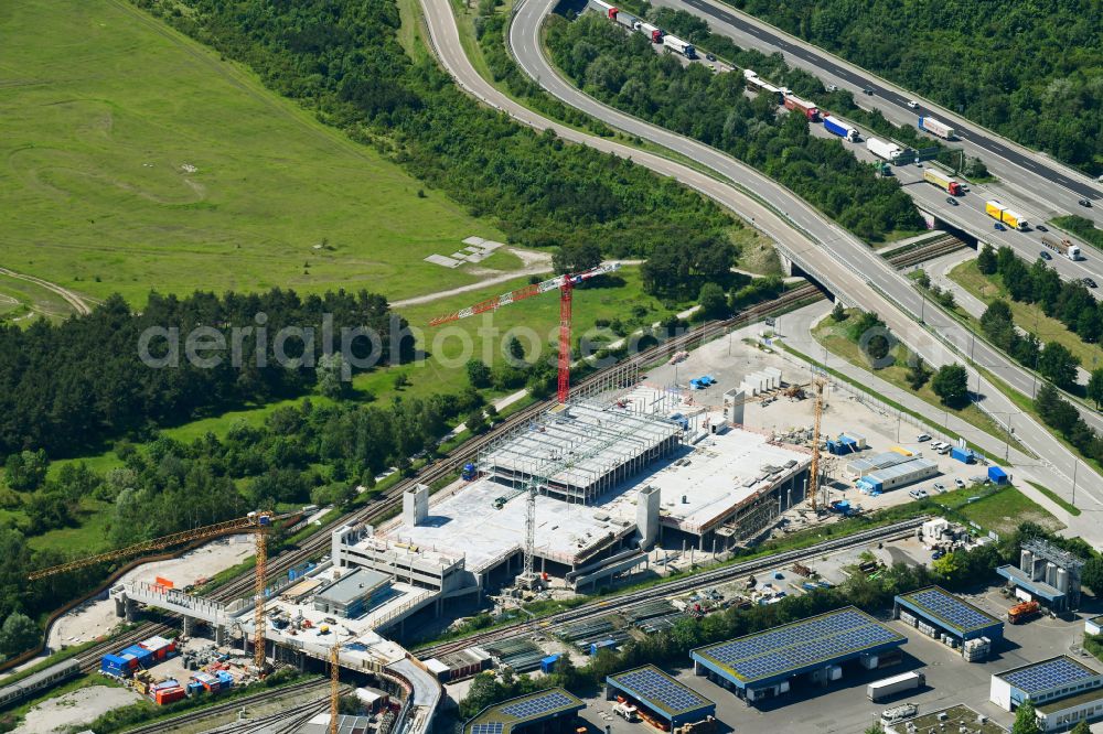 München from the bird's eye view: Construction site for the new parking garage on street Werner-Heisenberg-Allee in Munich in the state Bavaria, Germany