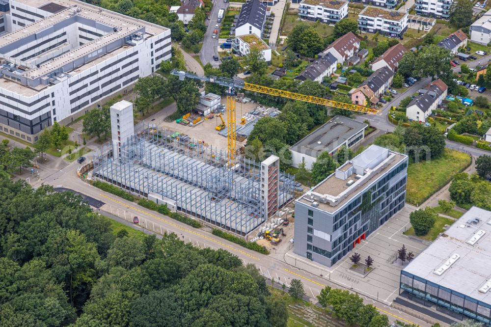 Bochum from the bird's eye view: Construction site for the new parking garage of the RUB University on Lennershofstrasse - Am Hochschulcampus - Oststrasse in the district of Querenburg in Bochum in the Ruhr area in the federal state of North Rhine-Westphalia, Germany