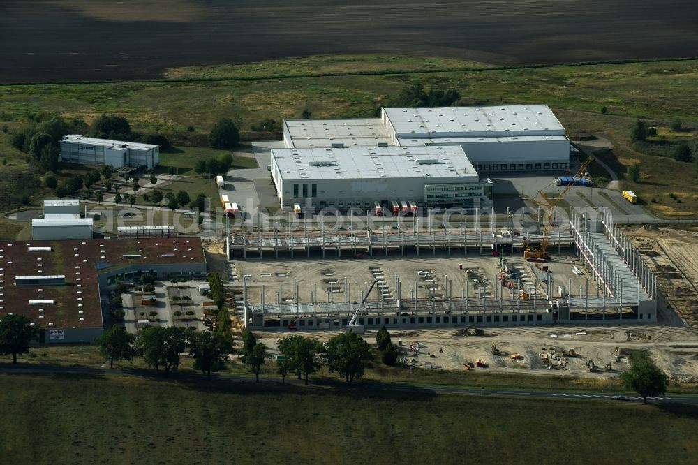 Trebbin from the bird's eye view: Construction site for the new building of Poco - Domaene- Zentrallager in Trebbin in the state Brandenburg