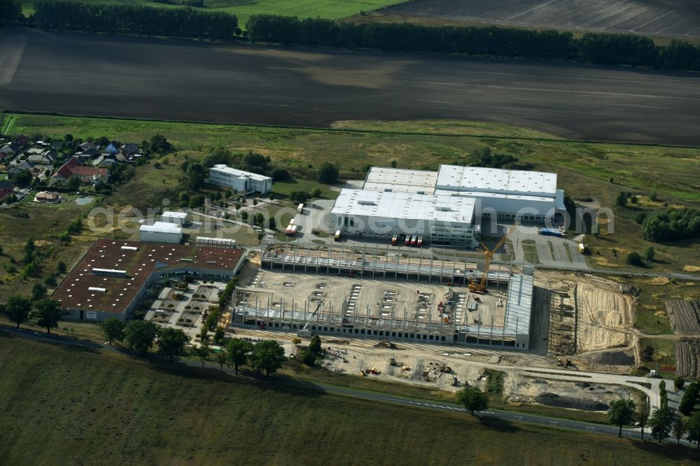 Trebbin from above - Construction site for the new building of Poco - Domaene- Zentrallager in Trebbin in the state Brandenburg