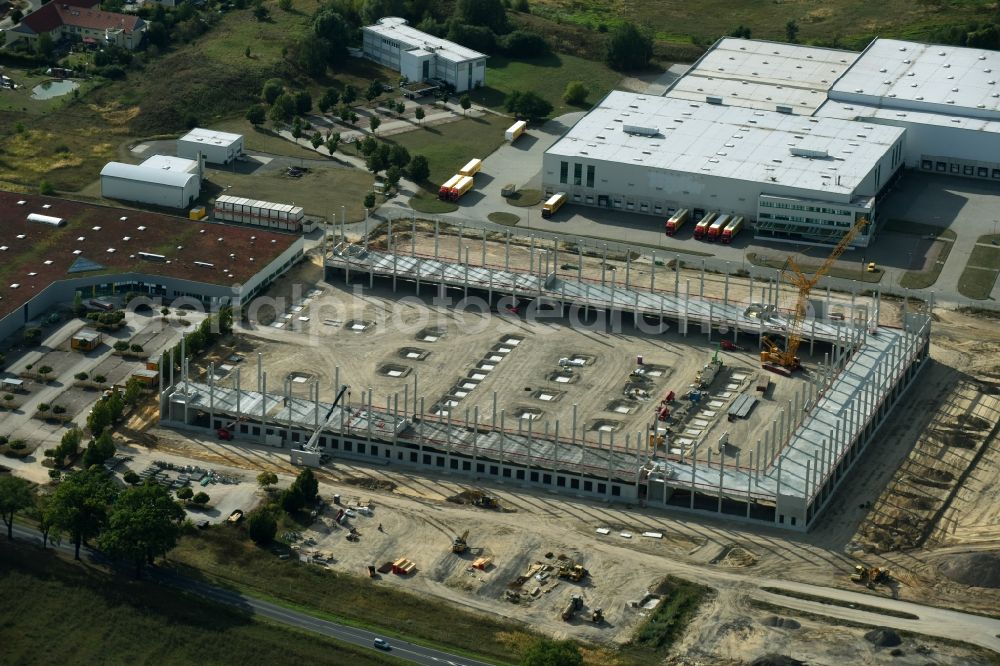 Trebbin from the bird's eye view: Construction site for the new building of Poco - Domaene- Zentrallager in Trebbin in the state Brandenburg