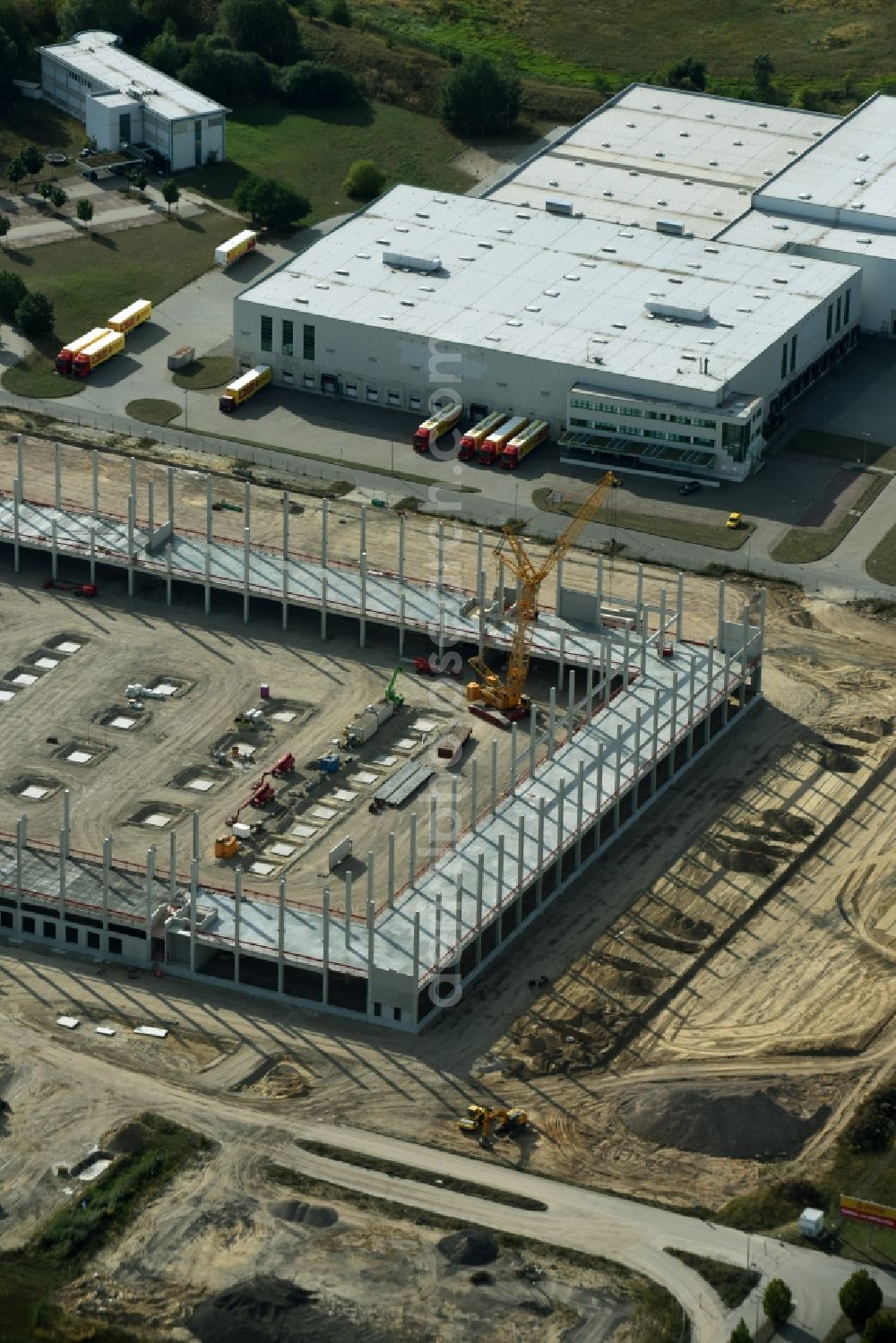 Trebbin from above - Construction site for the new building of Poco - Domaene- Zentrallager in Trebbin in the state Brandenburg