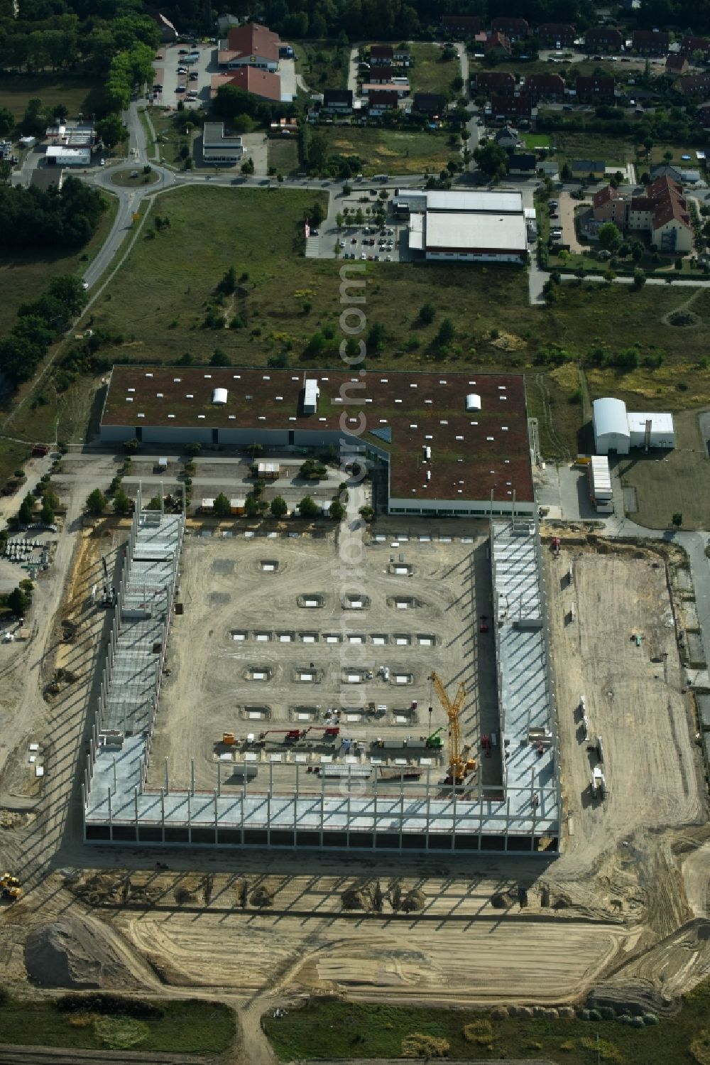 Trebbin from above - Construction site for the new building of Poco - Domaene- Zentrallager in Trebbin in the state Brandenburg