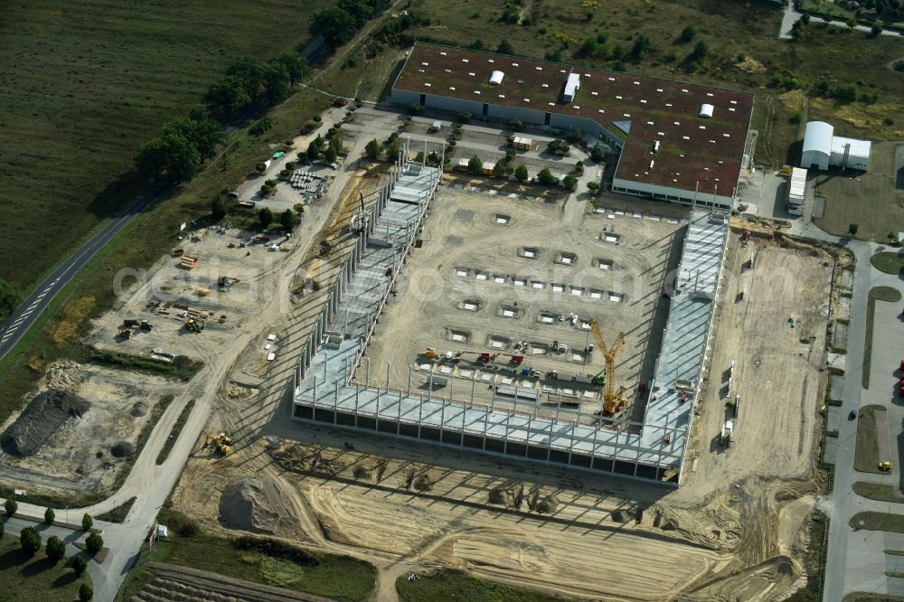 Trebbin from the bird's eye view: Construction site for the new building of Poco - Domaene- Zentrallager in Trebbin in the state Brandenburg