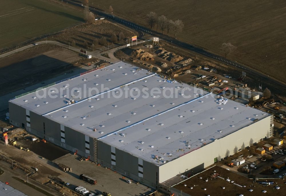 Trebbin from the bird's eye view: Construction site for the new building of Poco - Domaene- Zentrallager in Trebbin in the state Brandenburg