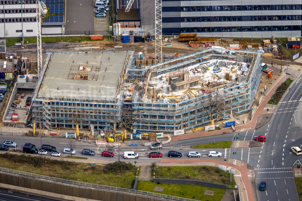 Duisburg from the bird's eye view: Construction site for the new building Quartier 1 of the Duisburger Freiheit on Wuhanstrasse in the Dellviertel district in Duisburg in the Ruhr area in the state of North Rhine-Westphalia