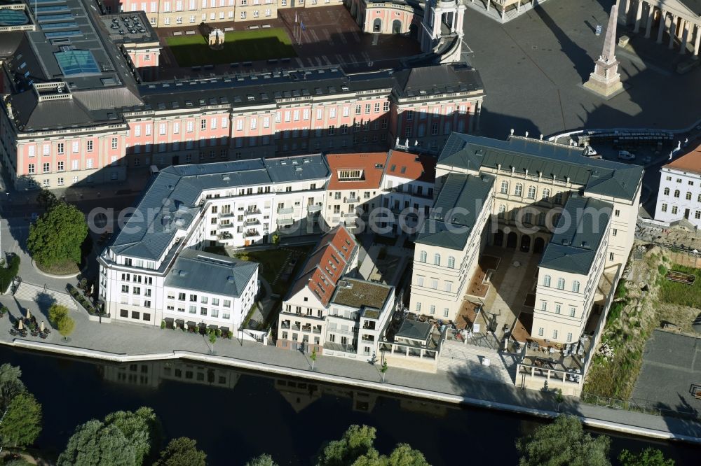 Potsdam from the bird's eye view: Construction site for the new building of the quarter HQ Humboldt in Potsdam in the state of Brandenburg. The Humboldt quarter is located on the riverbank of the Alte Fahrt and will include offices and residential apartments