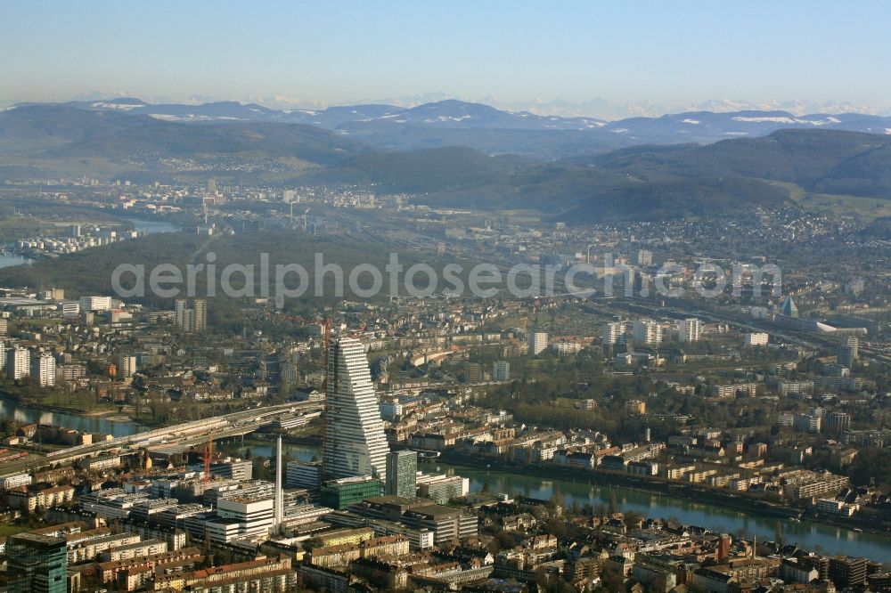 Aerial image Basel - Constructionprogress on Roche Tower on the premises of the pharmaceutical company Hoffmann-La Roche AG, Basel, Switzerland. The overall height of the building of 178 meters is reached. Thus, the Roche Tower is the tallest building in Switzerland. Upon completion in 2015, planned by the Basel architects Herzog & de Meuron, the building will be the headquarters of Hoffmann-La Roche AG