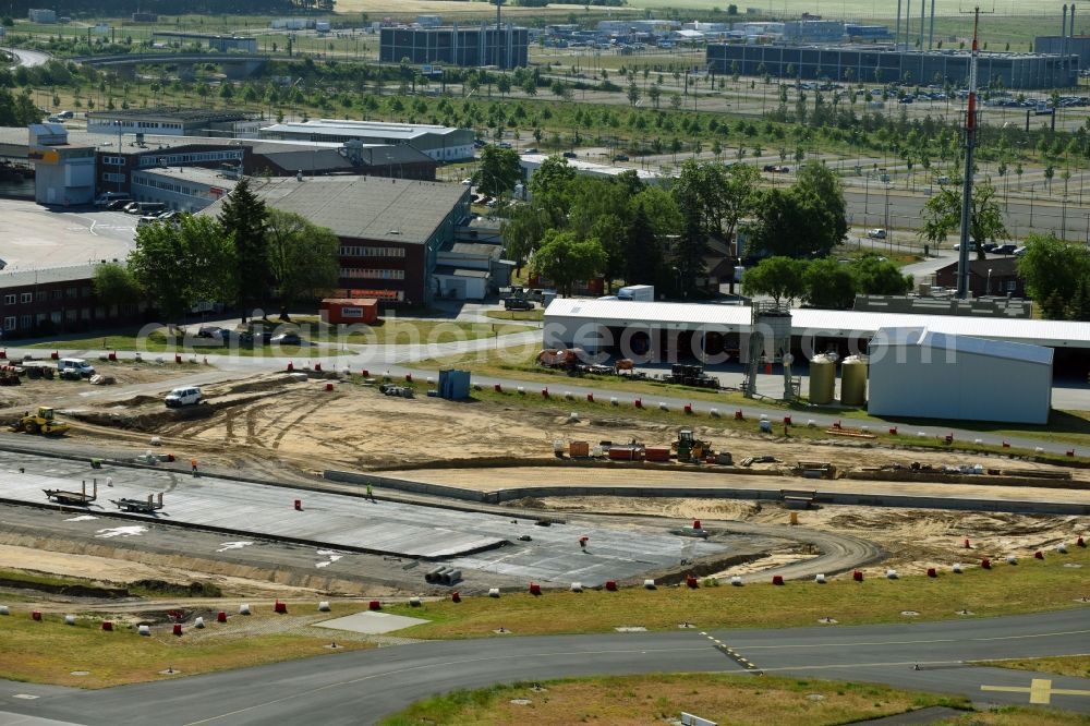 Schönefeld from above - Construction site of STRABAG Strassen- und Tiefbau AG for the construction of a roller track and taxiway on the airport grounds in Schoenefeld, Brandenburg, Germany