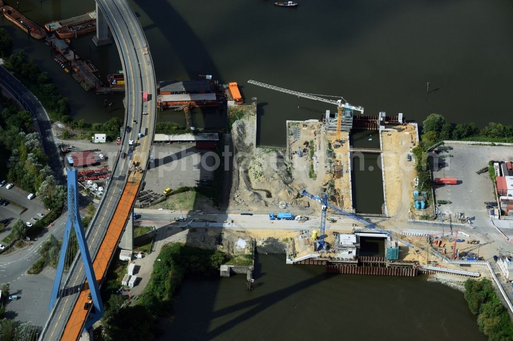 Hamburg from the bird's eye view: Construction site to build the new Rugenberger lock in Hamburg. Construction company is the August PRIEN GmbH & Co. KG