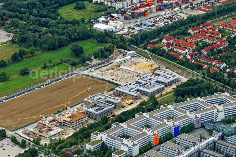 Unterföhring from the bird's eye view: New construction site of the school building on Ottostrasse - Mitterfeldallee in Unterfoehring in the state Bavaria, Germany