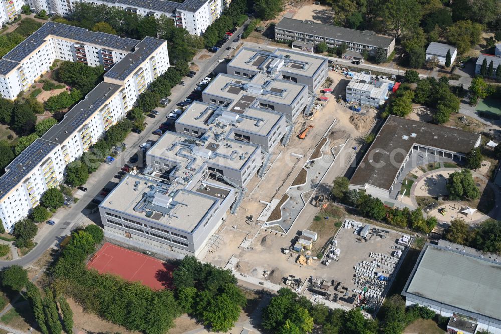 Berlin from above - New construction site of the school building Gymnasium with Sporthalle on street Erich-Kaestner-Strasse - Peter-Huchel-Strasse in the district Hellersdorf in Berlin, Germany