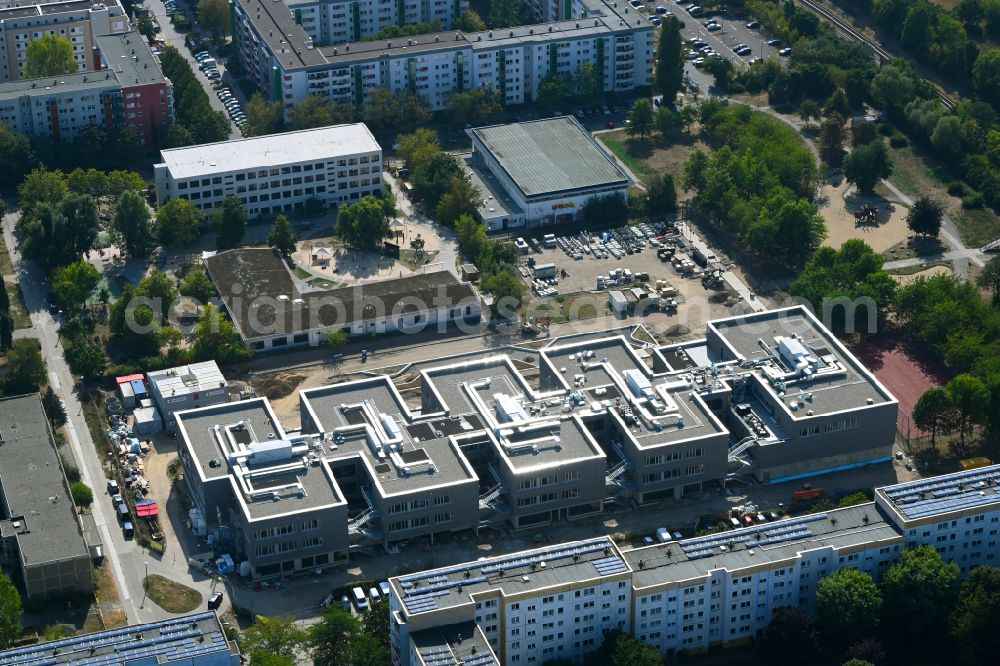 Berlin from above - New construction site of the school building Gymnasium with Sporthalle on street Erich-Kaestner-Strasse - Peter-Huchel-Strasse in the district Hellersdorf in Berlin, Germany