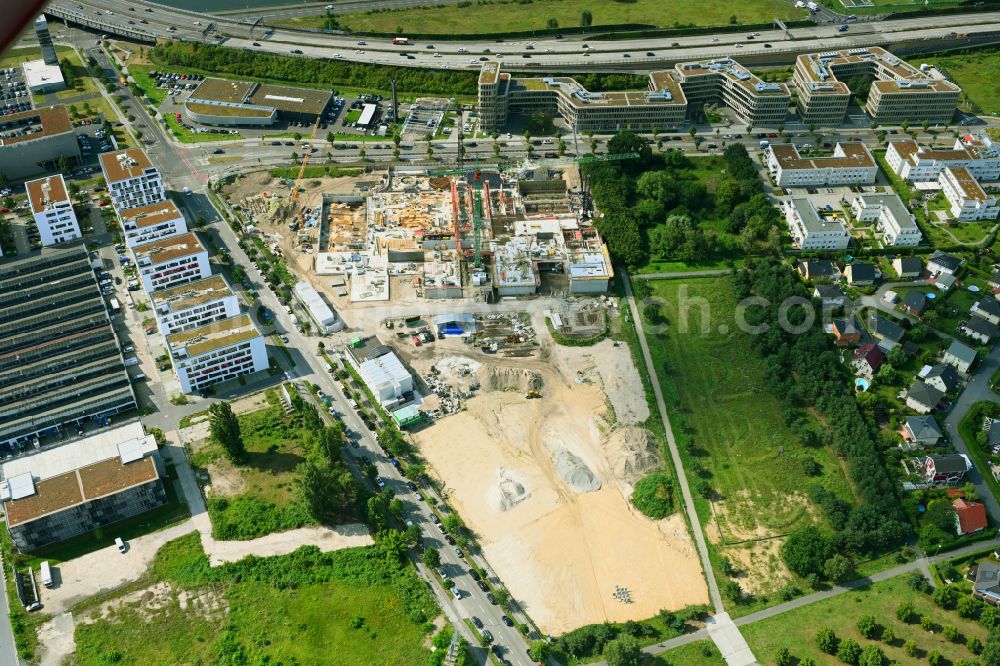 Aerial image Berlin - New construction site of the school building a community school on street Hermann-Dorner-Allee - Eisenhutweg in the district Adlershof in Berlin, Germany