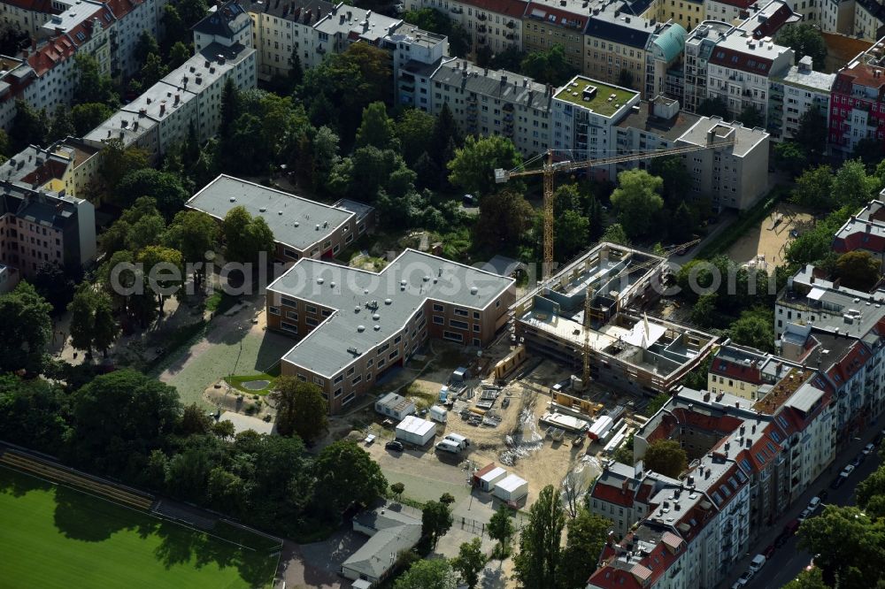 Berlin from the bird's eye view: New construction site of the school building of Johannes-Schule Berlin on Monumentenstrasse in Berlin, Germany